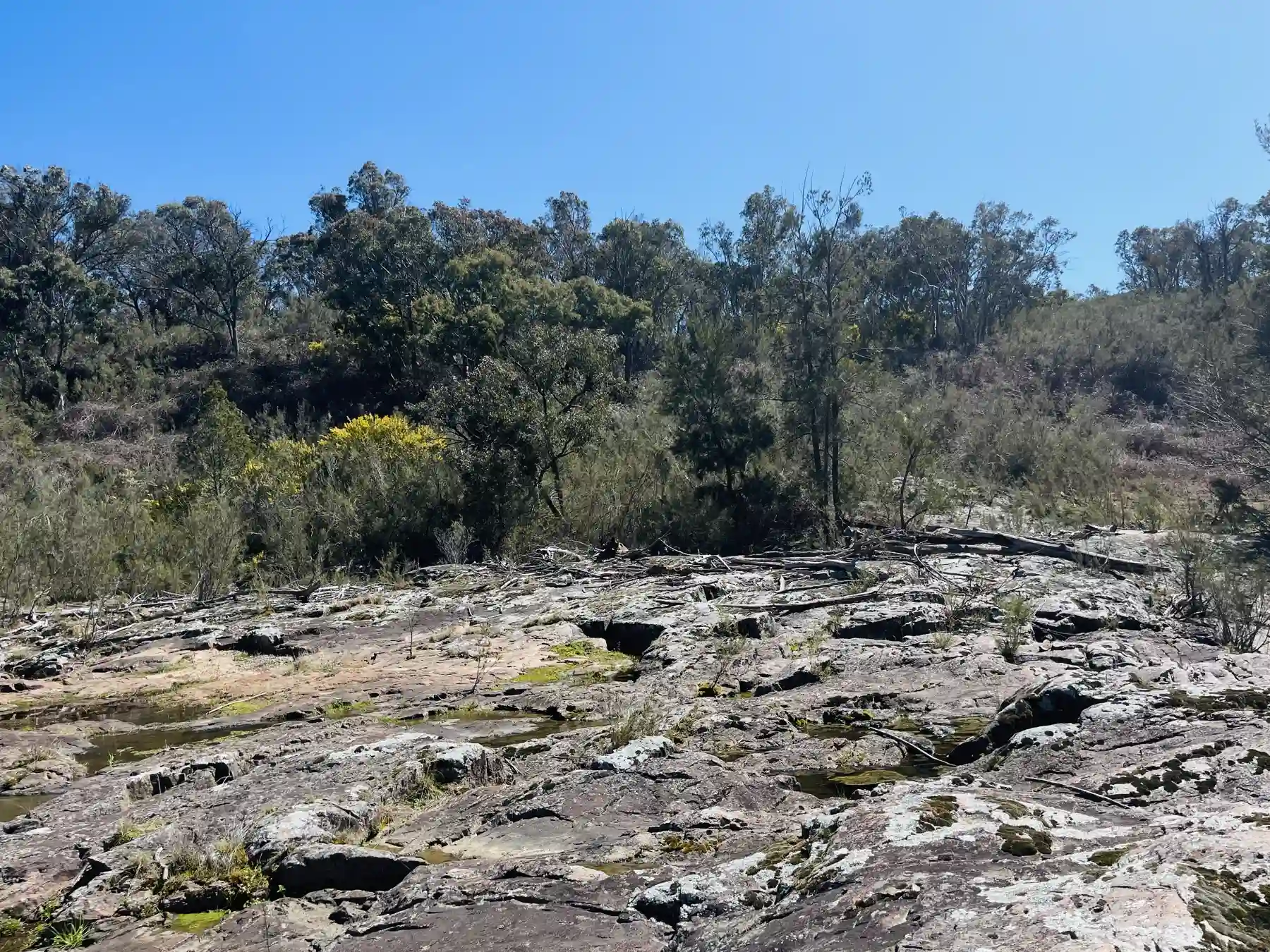 The broad granite riverbed